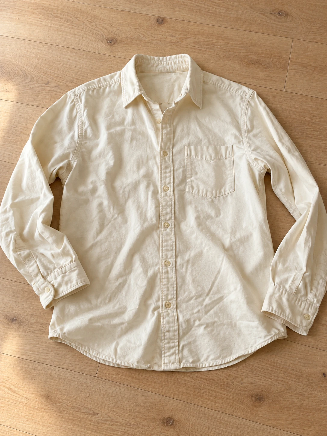 Cream shirt with a cleaner wood background